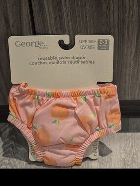 George Baby Pink Peach Print Reusable Swim Diaper With UPF 50+ Rating.